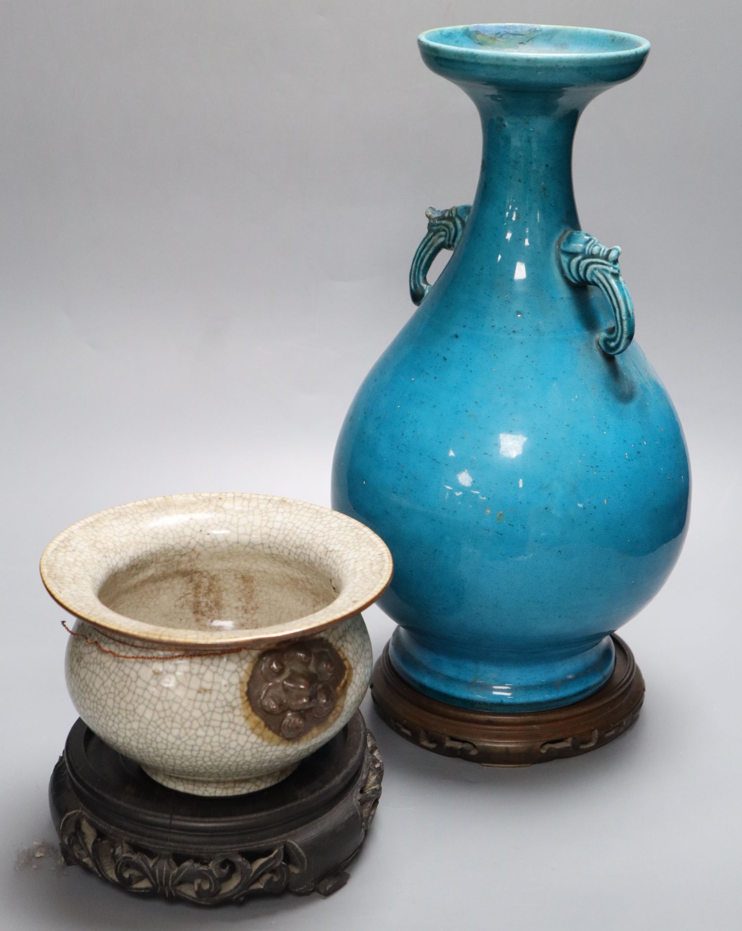 A 19th century Chinese crackleglaze squat bowl, with mask handles and a 19th century Chinese turquoise glazed baluster vase and two